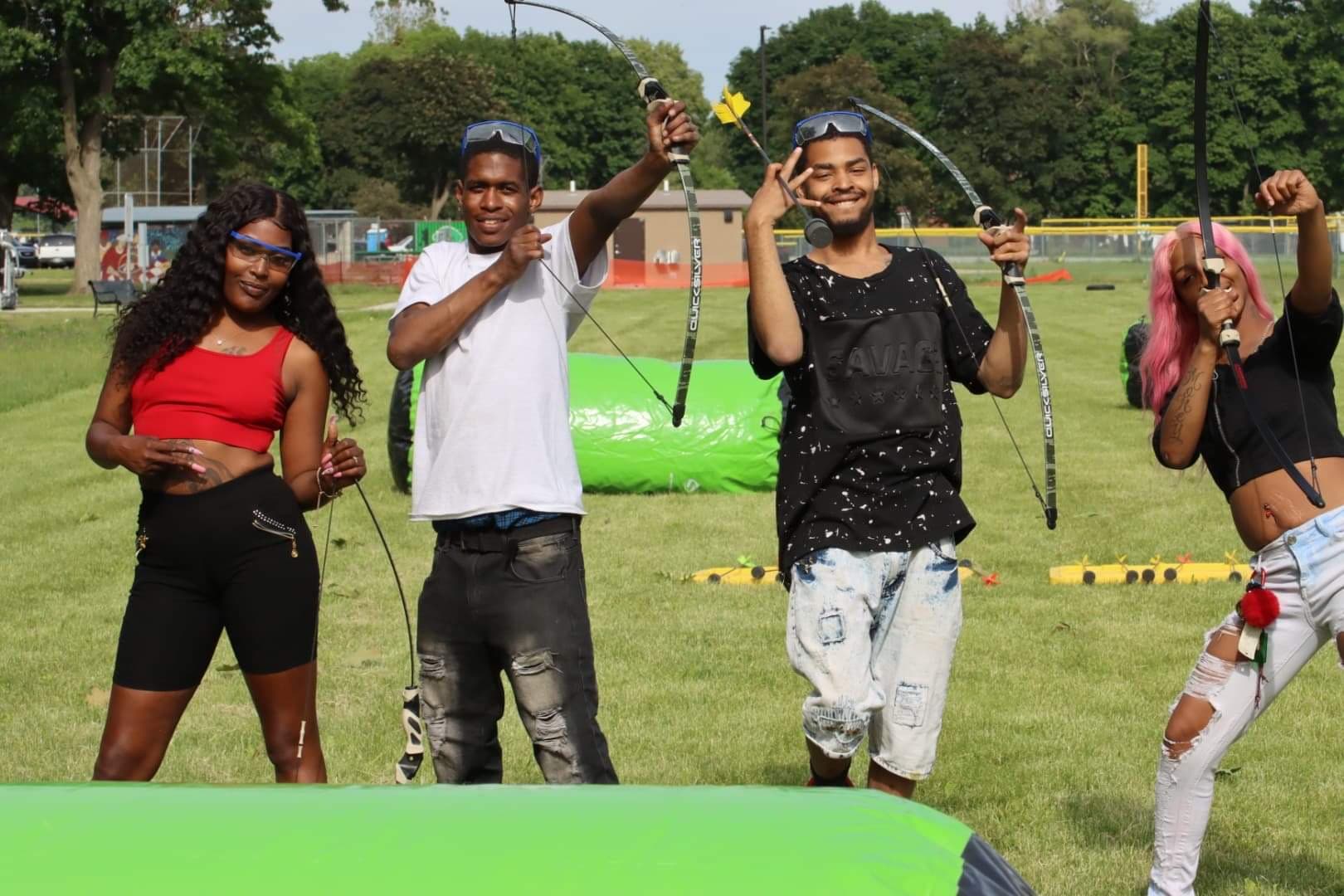 Group posing with Archery Tag equipment